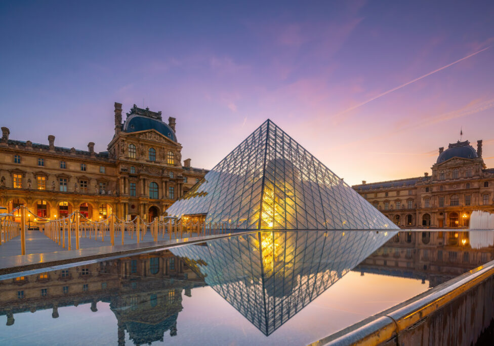 PARIS, FRANCE - SEPTEMBER 15, 2018 : The Louvre Museum and Louvre Pyramid in Paris, France at sunrise